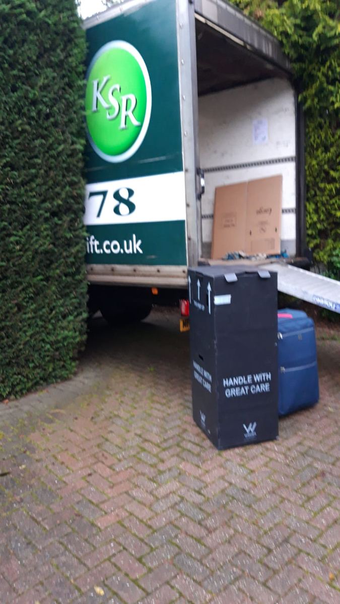 Boxes being loaded onto a Kwikshift van tail lift